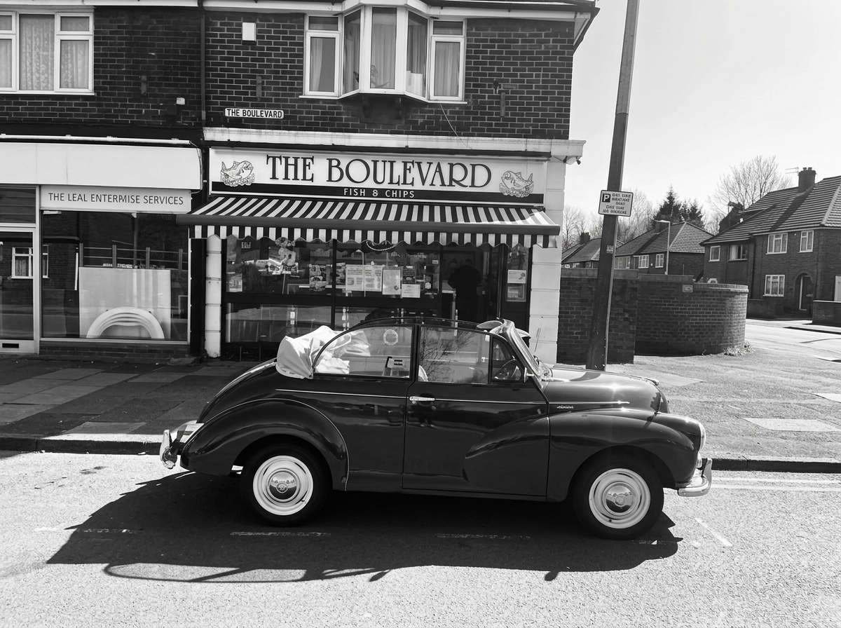 The Boulevard Chippy shopfront on a sunny day in Hazel Grove, Stockport